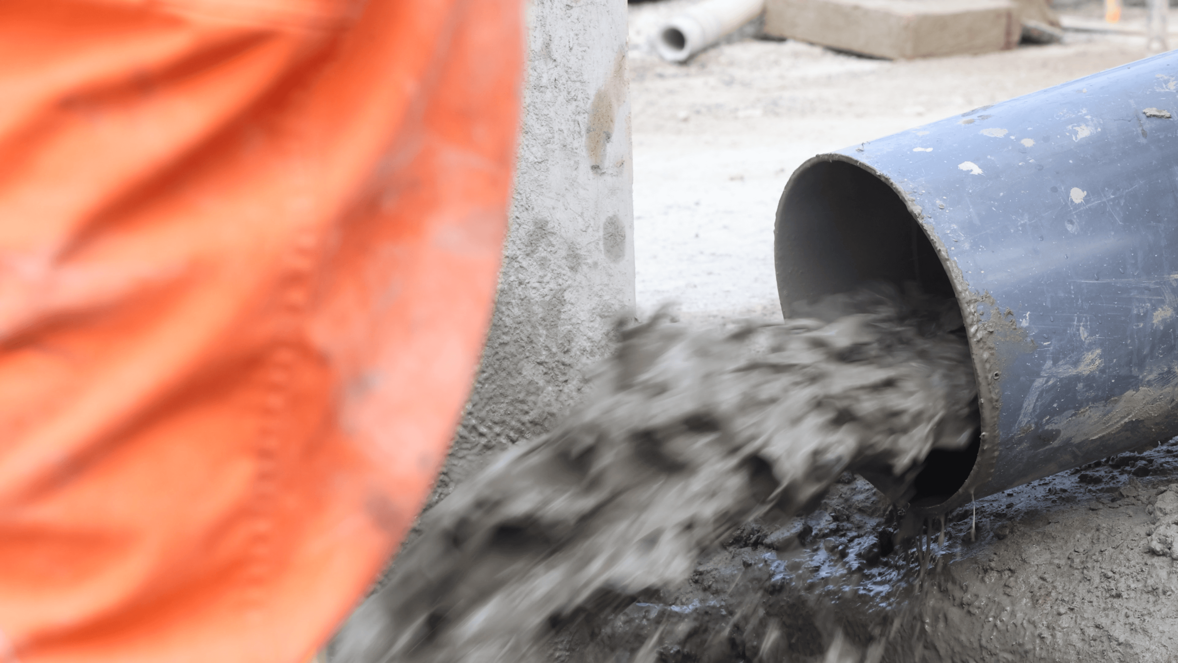 Slurry flowing from a pipe into material-handling equipment